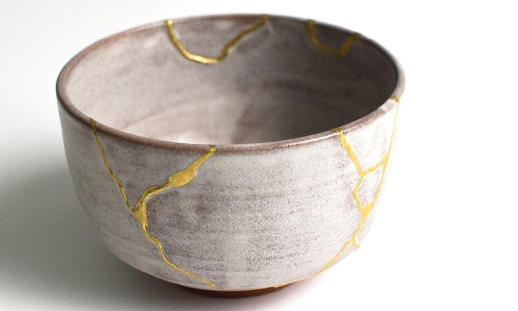 Antique Japanese ceramic kintsugi bowl restored with gold. Antique